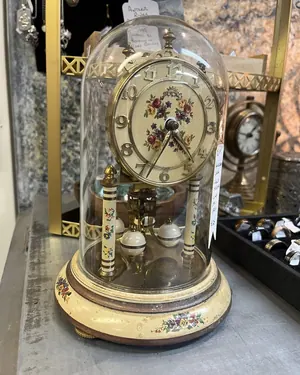 Anniversary clock under a glass dome