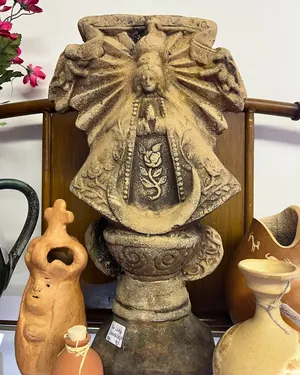 Carved stone garden statue