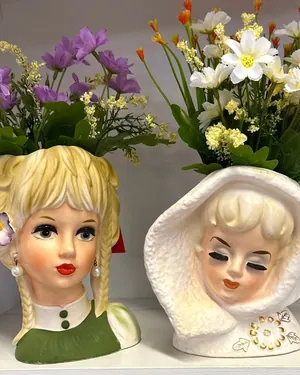 Vintage lady head vases with flowers