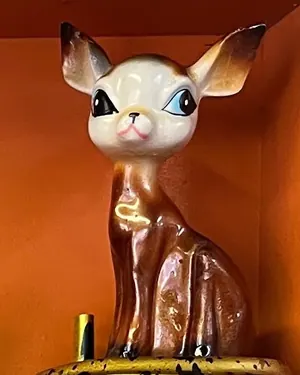 Glossy ceramic fawn figurine