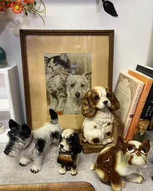 Porcelain dog figurines and a framed print