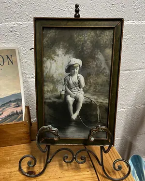 Framed vintage photograph of a child